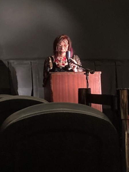 Maureen “Midge” Lansat, Honorary Premiere Chairman and Executive Director of Healing and Creative Arts Center (Benefactor for the Rainbow in the Night movie) speaking at the Rainbow in the Night Movie Premiere, Life Story of Jane "Goldie" Winn, Delray Beach, Florida, June 4, 2023.